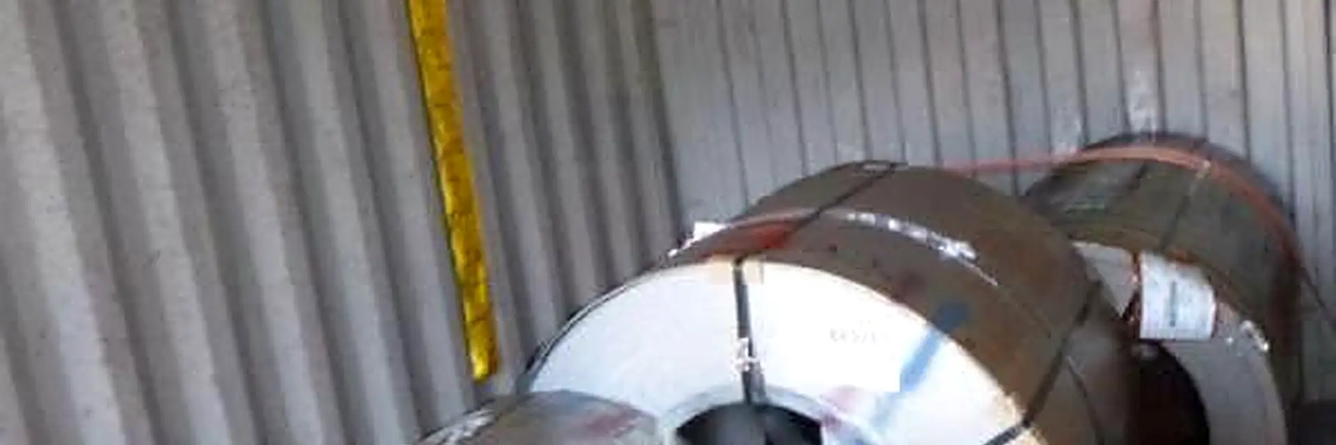 Steel coils strapped down inside a container