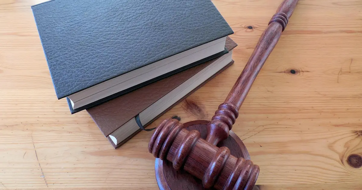 A book of regulations and documents on a desk