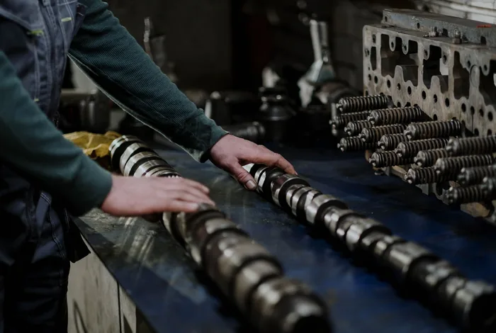 Machine parts dismantled for maintenance and repair in an industrial workshop