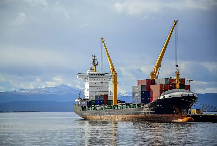 Cargo being loaded onto a ship at a port