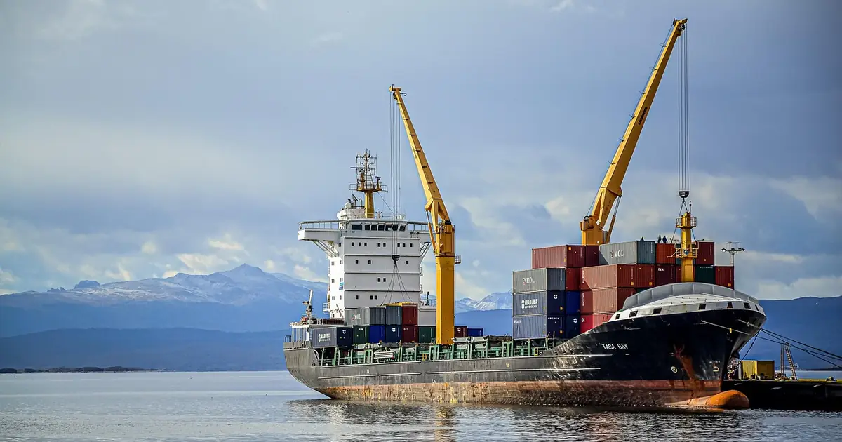 Cargo being loaded onto a ship at a port